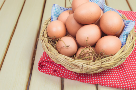 Eggs in a basket on wodden table