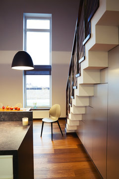 Chair and staircase in modern private house interior