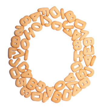 Round frame made of cookies in shape of letters and numbers