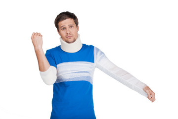 young man standing with cervical collar.