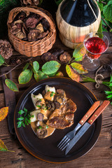 Steak with potato dumplings and forest mushroom sauce