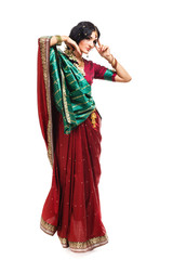 Fototapeta premium Beautiful young indian woman in traditional clothing, isolated