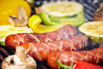 Grilling Sausages on barbecue grill