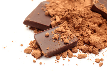 Pieces of chocolate in cocoa powder