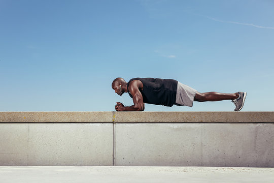 Strong Young Athlete Doing Core Exercise