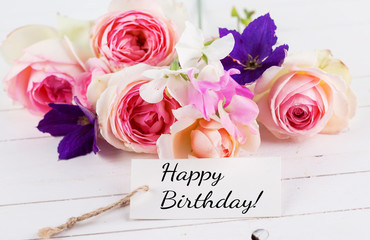 Postcard with elegant  flowers and  tag