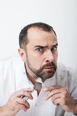 Man with a fork and knife