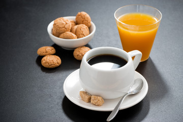 cup of coffee, italian cookies and orange juice