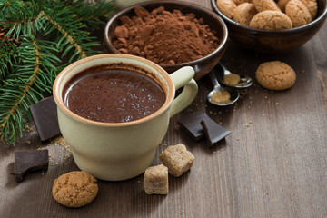 cup of hot chocolate and amaretti cookies on a wooden table