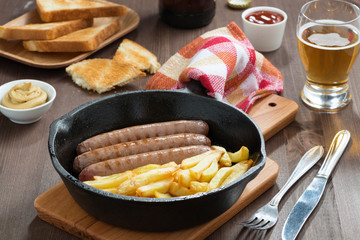 grilled sausages with French fries, toast and beer