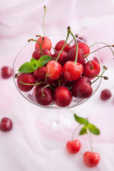 Fresh wet cherry in a glass