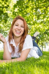 Pretty redhead relaxing in the park