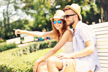 Young couple sitting on a bench