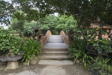 Fototapeta na wymiar wooden bridge garden