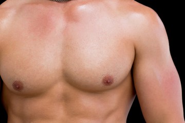 Close-up mid section of a shirtless muscular man