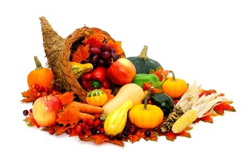 Thanksgiving cornucopia filled with fresh harvest vegetables