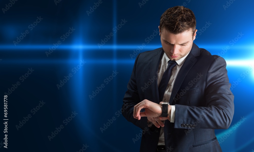 Poster composite image of handsome businessman checking the time