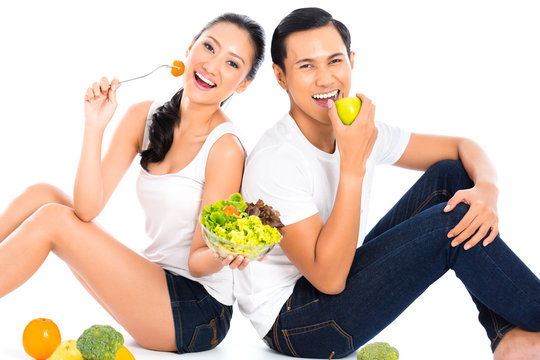 Asian Couple Eating Salad Fruit And Vegetables