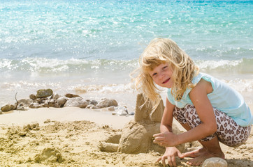 child building a sand castle