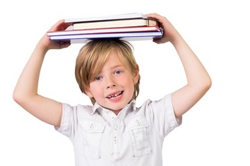 Student balancing books on his head
