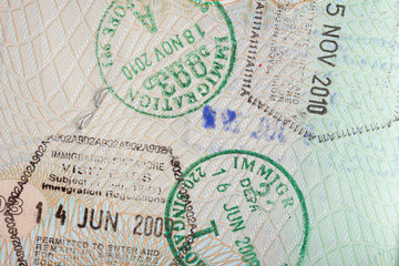 Closeup of several immigration stamps in a passport