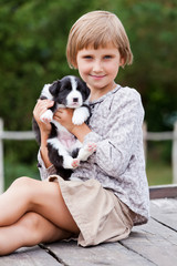 Little girl with the puppy