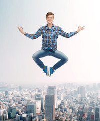 Fototapeta na wymiar smiling young man jumping in air