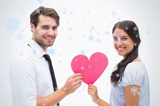 Composite image of pretty brunette giving boyfriend her heart