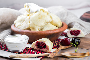 Ukrainian dumplings with cabbage, cheese and cherries