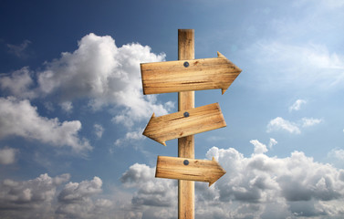 Wood sign on blue sky.