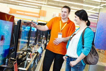 woman shopping at electronics supermarket