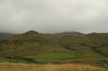 Southern Alps under thick low white clouds