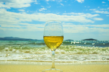 glass of wine on the beach