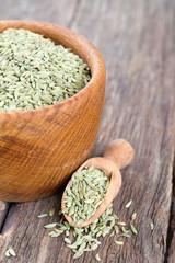 fennel seeds on wooden surface