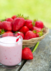 strawberry milk shake on wooden garden table