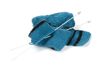 striped scarf on knitting needles