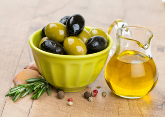 green and black olives in a green oil