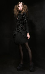 Fototapeta na wymiar Woman in black gothic dress