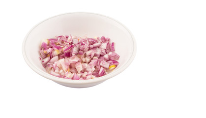Fototapeta na wymiar Chopped onions in a bowl over white background