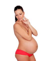Fototapeta premium Delicate pose of a pregnant woman with naked torso