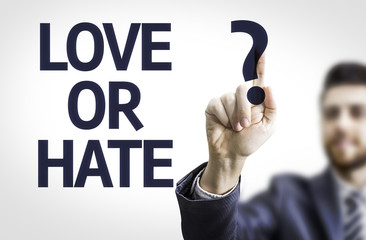 Business man pointing the text: Love or Hate?