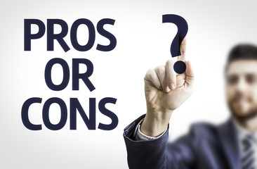 Business man pointing the text: Pros or Cons?