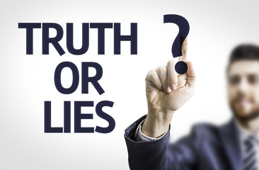Business man pointing the text: Truth or Lies?