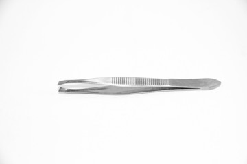 Little metal hair tweezers isolated over white background