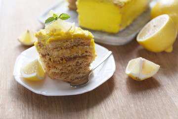 Tasty lemon dessert on wooden table