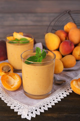 Apricot dessert in glasses on table close-up