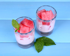 Watermelon cocktail in glasses on wooden table close-up