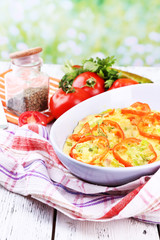 Casserole with vegetables in bowl  on natural background