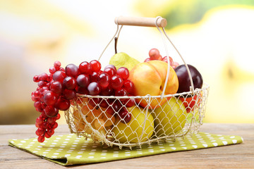 Assortment of juicy fruits in wicker basket