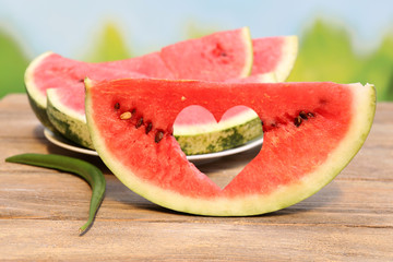 Fresh slice of watermelon on table outdoors, close up